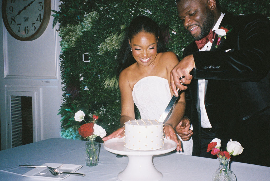 Couple Cutting Cake at The Exchange Wedding